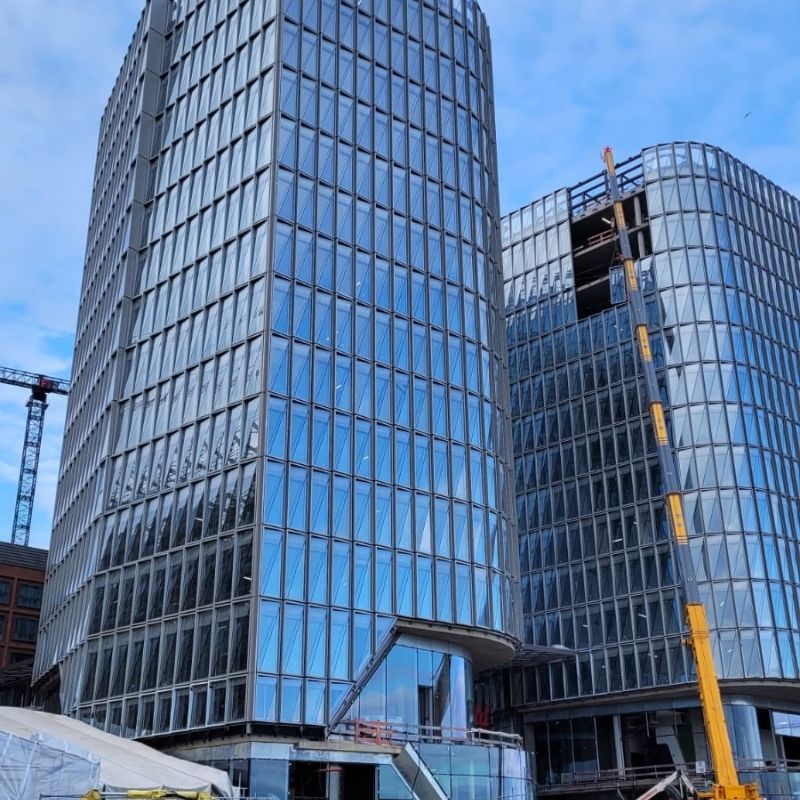 Glass facades for the Westfield Hamburg towers being installed by Anired Group