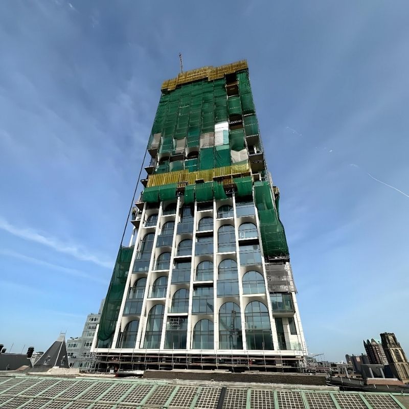 Fiber-reinforced concrete and glass tower of the former Rotterdam post office renovated by Anired Group